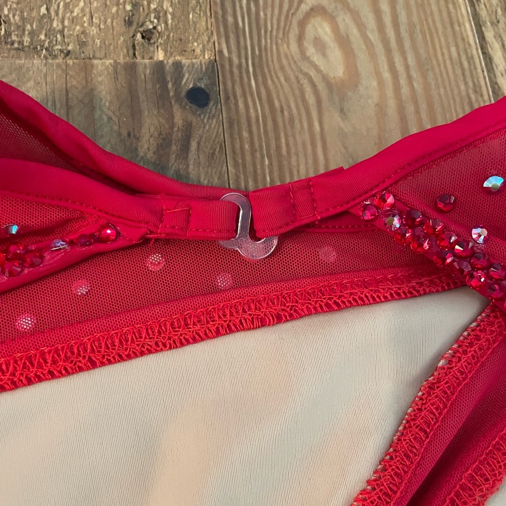 This is a red, rhinestoned, custom leotard. It’s a size adult XS. - Picture 3 of 4